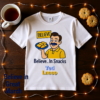 20251215103932-1f0d9a25-7505-6436-a436-4a0b90d79124-1.png Ted Lasso Inspired “Believe… In Snacks” T-Shirt, Funny TV Show Quote Tee, Positive Vibes Shirt, Gift for Fans