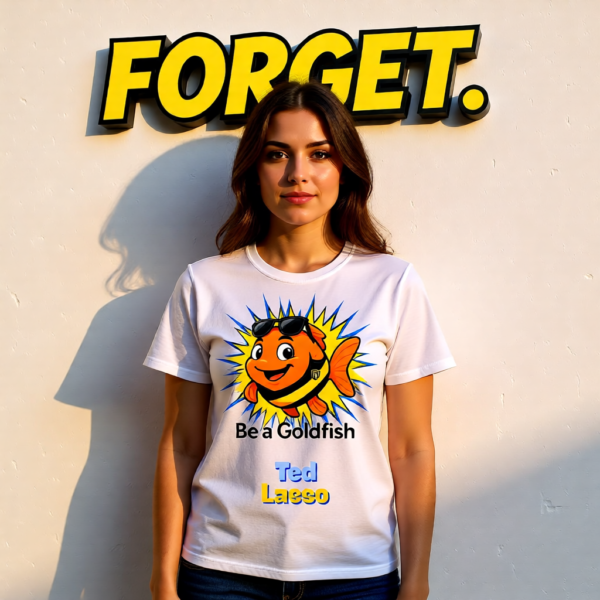 20251215112954-1f0d9a96-08ab-65a8-8b12-ca449830babf-1.png Ted Lasso Inspired “Be a Goldfish” T-Shirt, Motivational TV Show Quote Tee, Positive Mindset Shirt, Gift for Fans